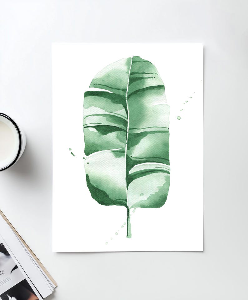 Watercolor banana leaf art print with lush green tones, perfect for tropical and botanical wall decor. Minimalist design captures nature-inspired style, adding a refreshing vibe to modern, bohemian, or office spaces. Unframed, ready to be styled