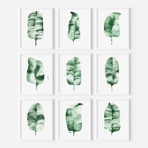 Watercolor banana leaf art print with lush green tones, perfect for tropical and botanical wall decor. Minimalist design captures nature-inspired style, adding a refreshing vibe to modern, bohemian, or office spaces. Unframed, ready to be styled