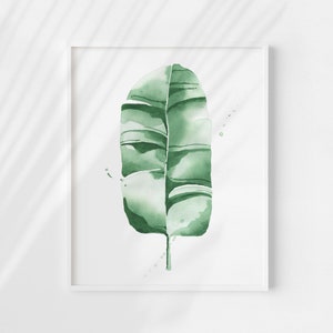 Watercolor banana leaf art print with lush green tones, perfect for tropical and botanical wall decor. Minimalist design captures nature-inspired style, adding a refreshing vibe to modern, bohemian, or office spaces. Unframed, ready to be styled