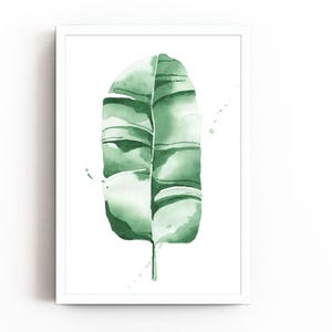 Watercolor banana leaf art print with lush green tones, perfect for tropical and botanical wall decor. Minimalist design captures nature-inspired style, adding a refreshing vibe to modern, bohemian, or office spaces. Unframed, ready to be styled