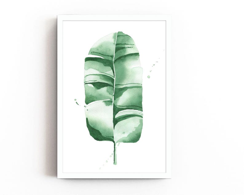 Watercolor banana leaf art print with lush green tones, perfect for tropical and botanical wall decor. Minimalist design captures nature-inspired style, adding a refreshing vibe to modern, bohemian, or office spaces. Unframed, ready to be styled
