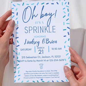 May include: A baby shower invitation with the text "Oh boy! It's a Sprinkle" in blue script. The invitation is decorated with blue confetti and includes the honoree's name, date, time, and location.