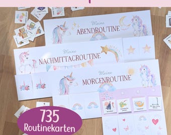 May include: A set of three white routine planner charts featuring unicorn illustrations and the German text Meine Abendroutine, Meine Nachmittagsroutine, and Meine Morgenroutine. Includes numerous small square cards with various icons.