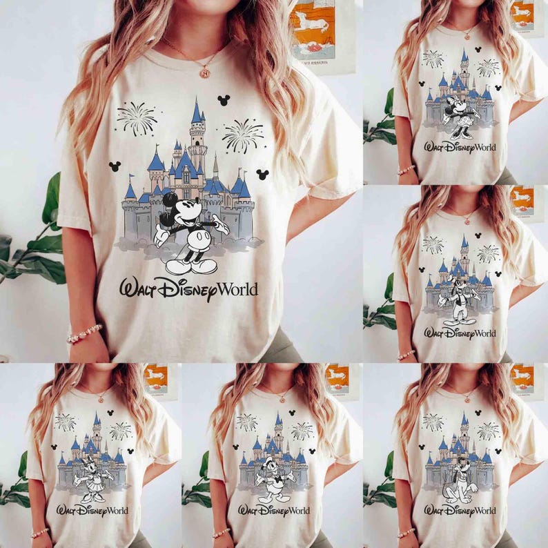 May include: Cream-colored t-shirts featuring various Disney characters in front of Cinderella's castle. The text "Walt Disney World" is printed below the castle. The designs include Mickey Mouse, Minnie Mouse, Donald Duck, and Goofy.