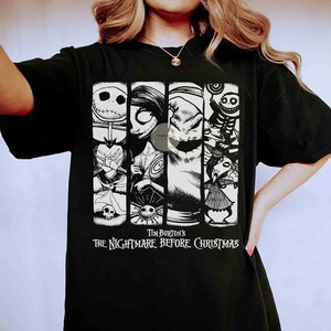 May include: Black t-shirt with a graphic from Tim Burton's "The Nightmare Before Christmas." The design features Jack Skellington, Sally, Oogie Boogie, and other characters in vertical panels. The film's title is printed below the characters.