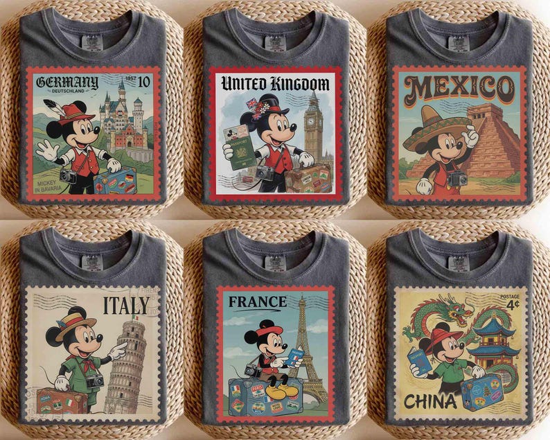 May include: Six grey t-shirts, each with a postage stamp design featuring Mickey Mouse and a different country. Countries include Germany, United Kingdom, Mexico, Italy, France, and China. The stamps have red borders and feature country names and landmarks.