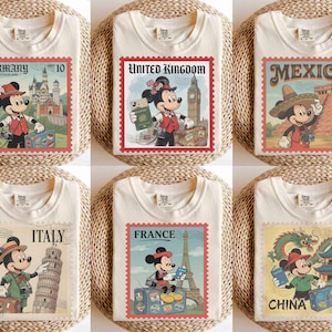 May include: Off-white t-shirts with Mickey Mouse travel stamp designs. Each shirt features a different country: Germany, United Kingdom, Mexico, Italy, France, and China. The stamps have a vintage look with detailed illustrations.