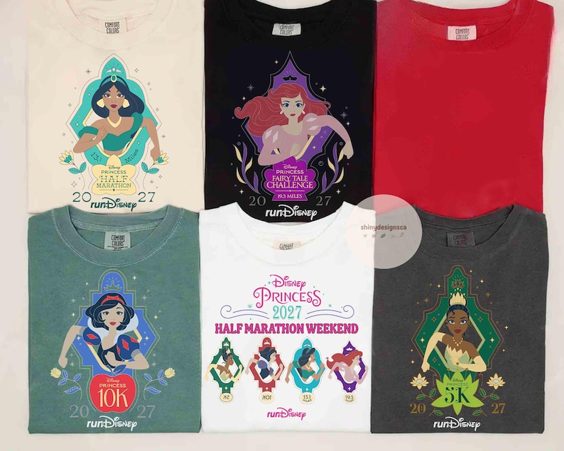 May include: Six t-shirts featuring Disney Princess graphics. The shirts are cream, black, red, sage green, white, and charcoal gray. Each shirt displays character illustrations, the text Disney Princess, runDisney, and the year 2027.
