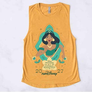 May include: A mustard yellow sleeveless tank top featuring a graphic of Princess Jasmine in a teal frame. The design includes the text 13.1 Miles, Disney Princess Half Marathon, 2027, and runDisney. The illustration shows Jasmine with dark hair.