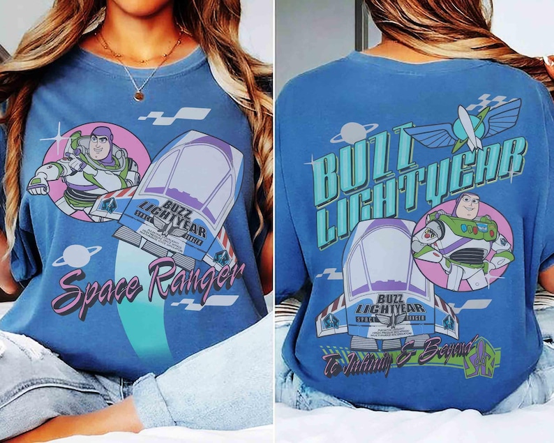 May include: A blue t-shirt featuring Buzz Lightyear graphics. The front displays Buzz Lightyear, a spaceship, and the text Space Ranger. The back shows Buzz Lightyear, a spaceship, the text Buzz Lightyear, and the phrase To Infinity & Beyond.