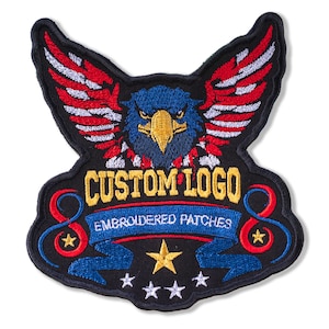 May include: Embroidered patch featuring an eagle design with red, white, and blue accents. The patch has the text "CUSTOM LOGO" above a blue banner that reads "EMBROIDERED PATCHES". Includes gold stars.