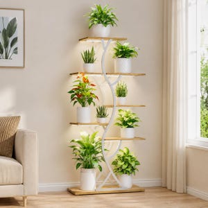May include: A tall, multi-tiered plant stand featuring a white metal frame with a curved, tree-like design and light-colored wooden shelves. The stand holds nine potted green plants of various sizes, with integrated LED lighting under each shelf.
