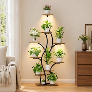 May include: A tall, black metal plant stand with a curved, tree-like frame featuring multiple wooden shelves at varying heights. Each shelf holds a potted green plant, and integrated LED lights under the shelves illuminate the foliage.