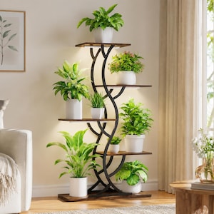 May include: A tall, multi-tiered plant stand featuring a black metal frame with curved, branch-like supports and dark wood-toned shelves. The unit holds eight potted green plants in white containers, with integrated LED lighting under each shelf.