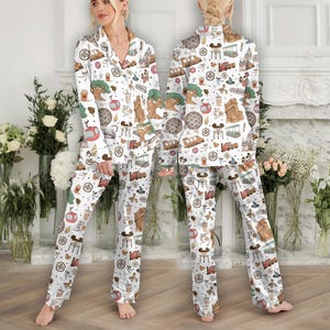 May include: A handmade wooden sign with the text "Welcome to our home" in a handwritten style. The sign is painted white with a distressed finish and a black border. A small, decorative heart is attached to the bottom.