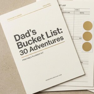 May include: A printable planner kit titled Dad's Bucket List: 30 Adventures, featuring a list page, a numbered progress tracker, three gold circular stickers, and a wooden pen with a gold cap, all printed on off-white paper with black text.