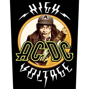 May include: Black graphic featuring the band AC/DC with the words "HIGH VOLTAGE" and a portrait of a musician playing a guitar. The band's name is in yellow with a lightning bolt. The musician is wearing a hat with the letter "A".