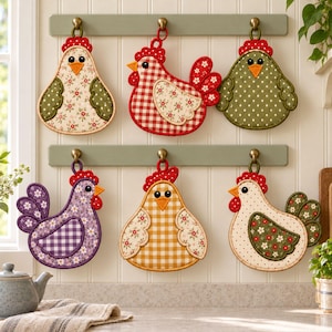 May include: Six fabric chicken-shaped pot holders hanging on two wall-mounted racks. The pot holders feature various patterns including red gingham, yellow gingham, purple plaid, and floral prints, all with red combs and orange beaks.