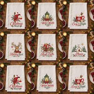 May include: A set of nine white kitchen towels featuring festive holiday illustrations and text including Christmas Mail, Warm Winter Wishes, Cozy & Bright, Holiday Spirit, Sleigh Bells Ring, and Peace on Earth, decorated with pine and holly.