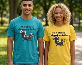May include: Two people wearing matching t-shirts. One shirt is teal, the other is yellow. Each shirt has the text "I'm A Stinker without my Coffee" above a cartoon skunk illustration. The skunk is black and white.