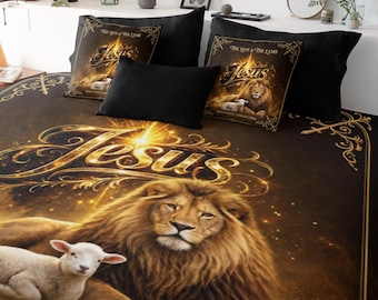 May include: A bedding set featuring a dark brown and gold comforter and two matching square pillows. The design displays a lion and a lamb with the text Jesus, The Lion & The Lamb, and King of Kings - Lord of Lords in gold lettering.