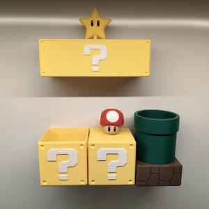 May include: A yellow question mark box, a star, a mushroom, and a green pipe, all inspired by a video game. The star is yellow with a smiling face. The mushroom has a red cap with white spots. The pipe is dark green.