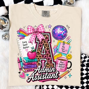 May include: A beige t-shirt featuring a large letter A with a leopard print pattern, a pink gingham bow, a disco ball, a stack of books labelled Organize, Support, Manage, Achieve, a mug labelled Plan Support Achieve, and text Every Detail Matters.