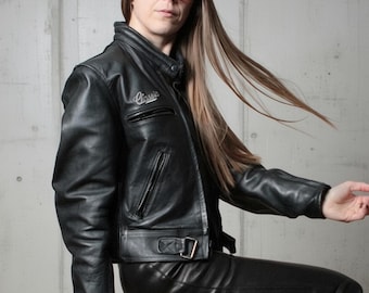 2000s Minimalist black leather motorcycle jacket with inner pockets