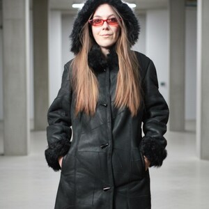 Hooded black shearling sheepskin coat with fur interior