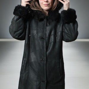 Hooded black shearling sheepskin coat with fur interior