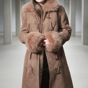 vintage brown sheepskin coat with shearling fur collar and hems