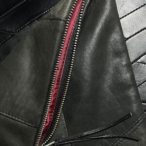 Large fold-over leather clutch bag with burgundy red interior