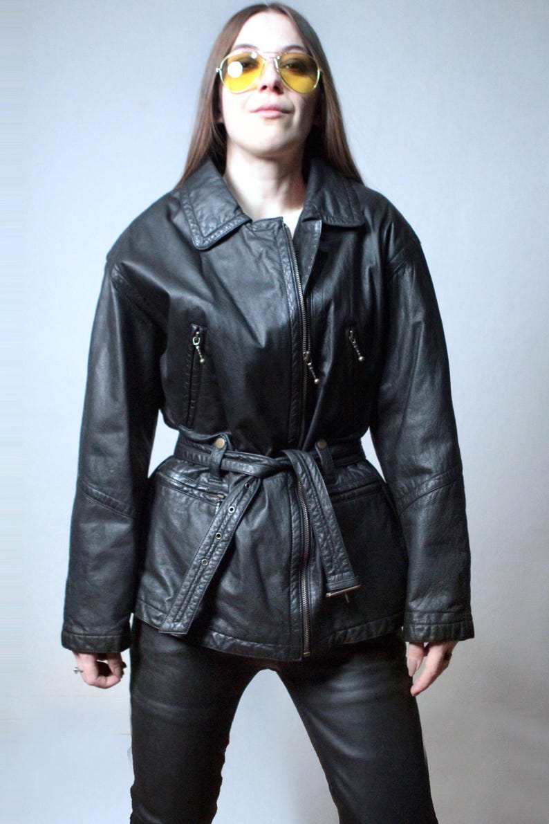 Vintage black leather jacket with a belt