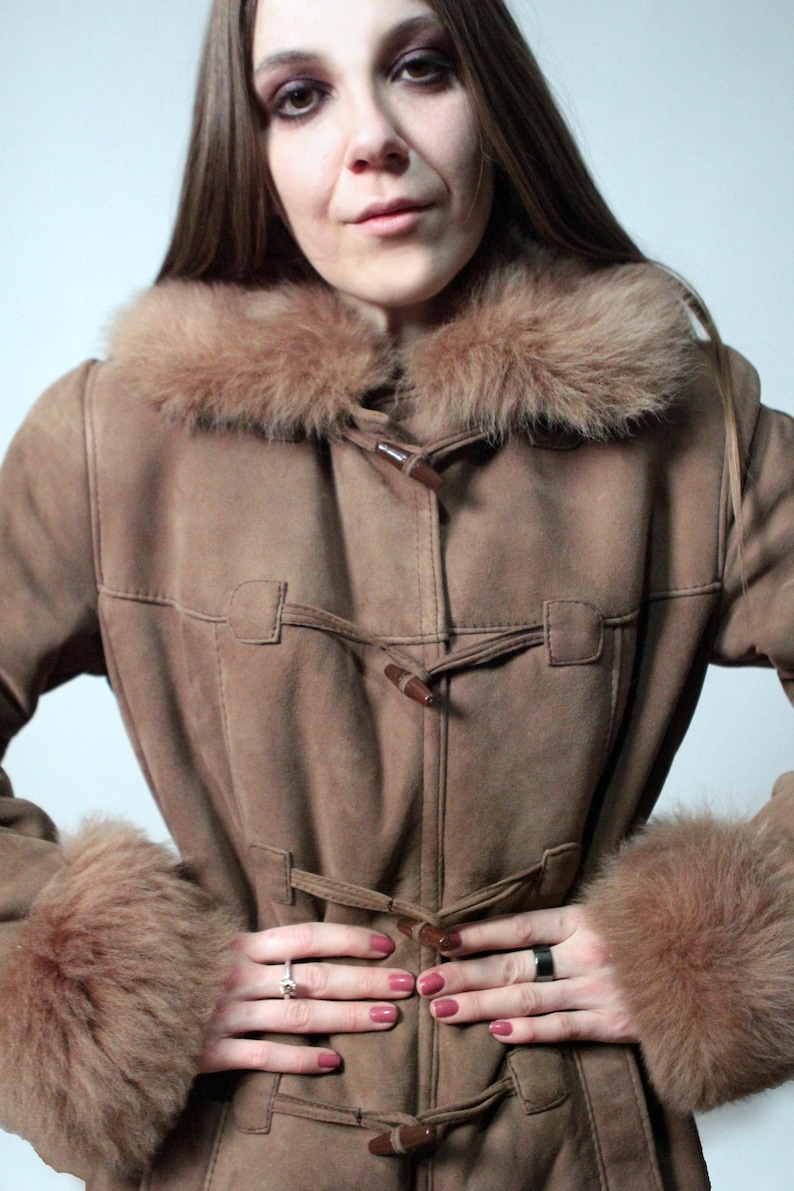vintage brown sheepskin coat with shearling fur collar and hems