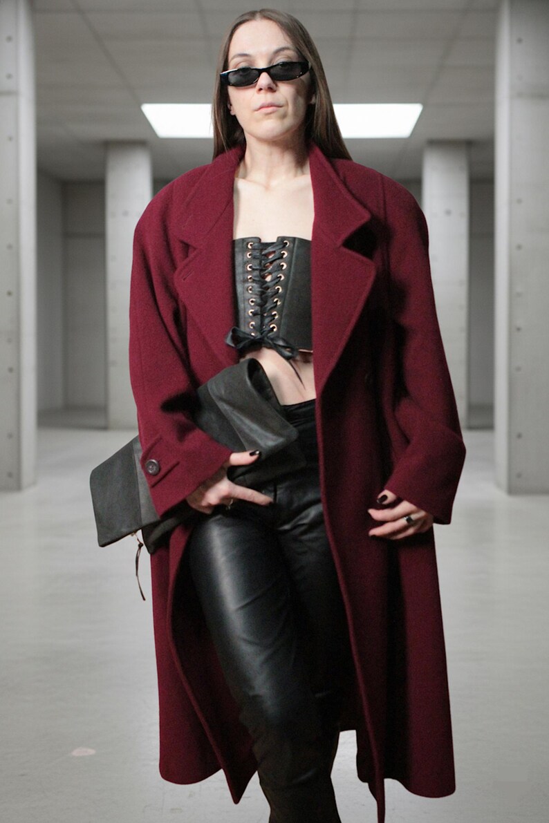 Large fold-over leather clutch bag with burgundy red interior