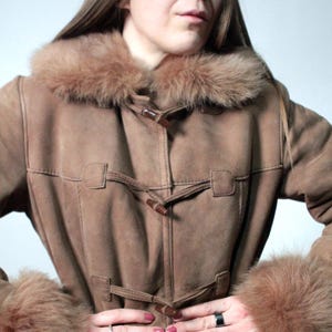 vintage brown sheepskin coat with shearling fur collar and hems