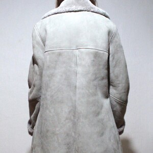oversized sheepskin jacket with grey shearling interior and wooden buttons