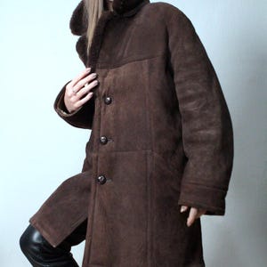 mens brown sheepskin coat with large collar and beige shearling interior