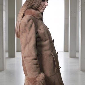 vintage brown sheepskin coat with shearling fur collar and hems