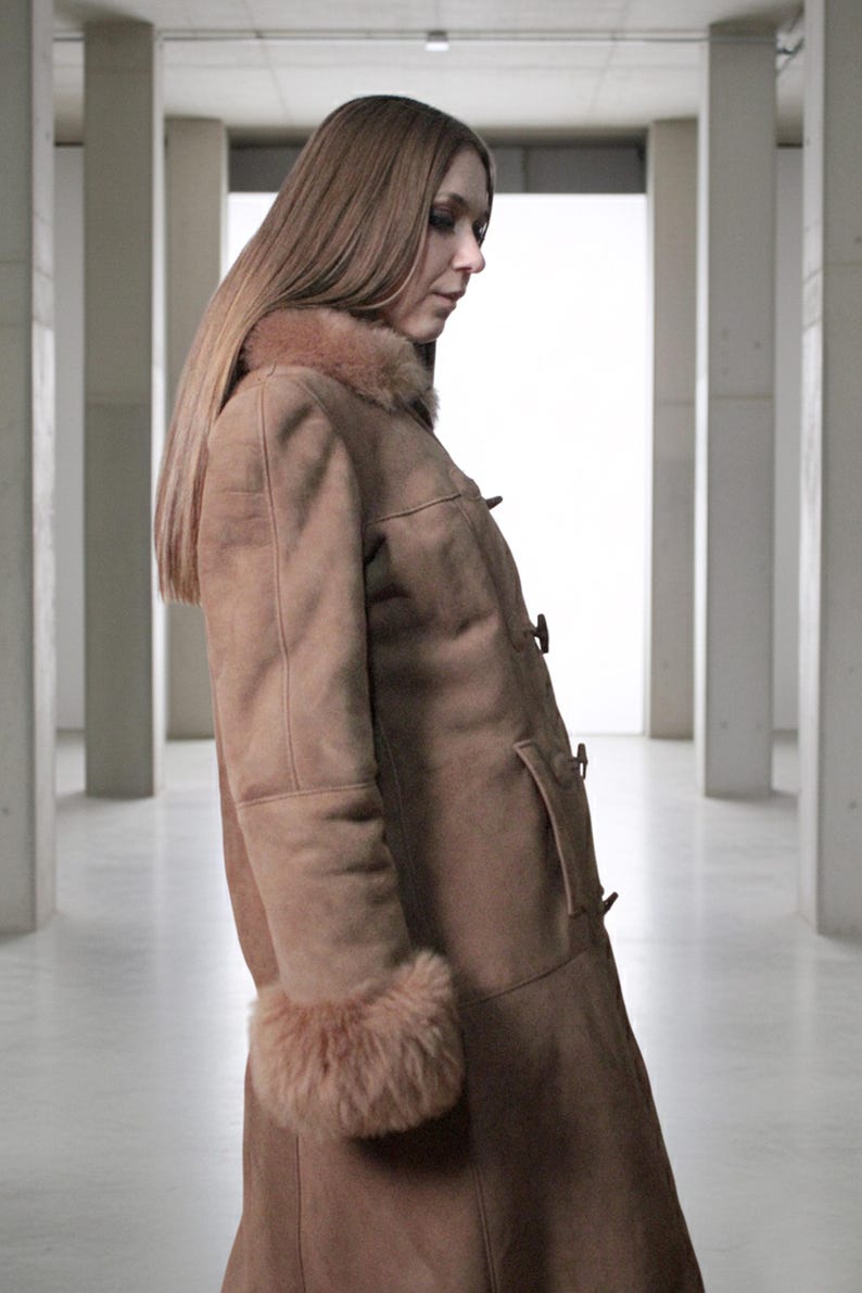 vintage brown sheepskin coat with shearling fur collar and hems