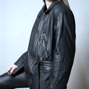 Vintage black leather jacket with a belt