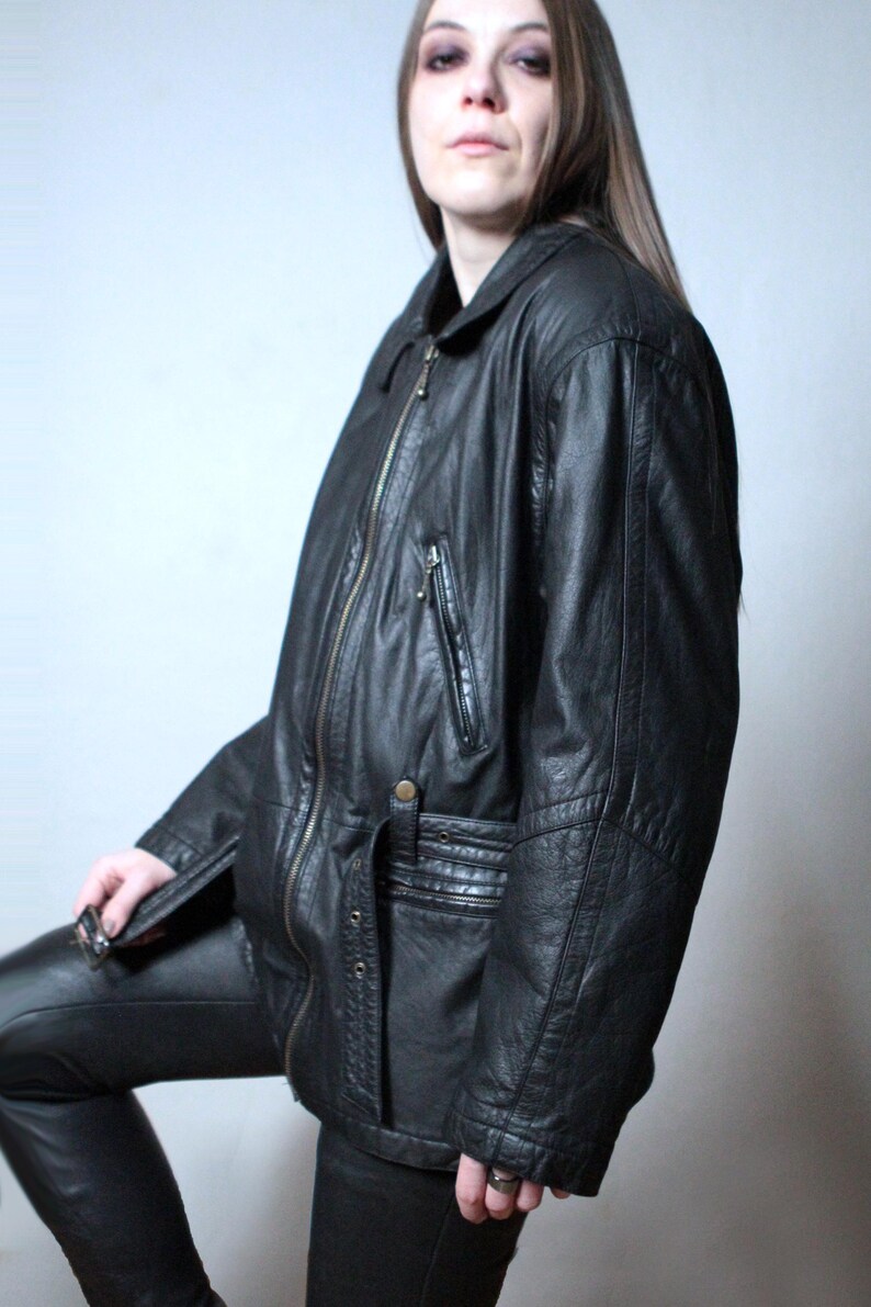 Vintage black leather jacket with a belt