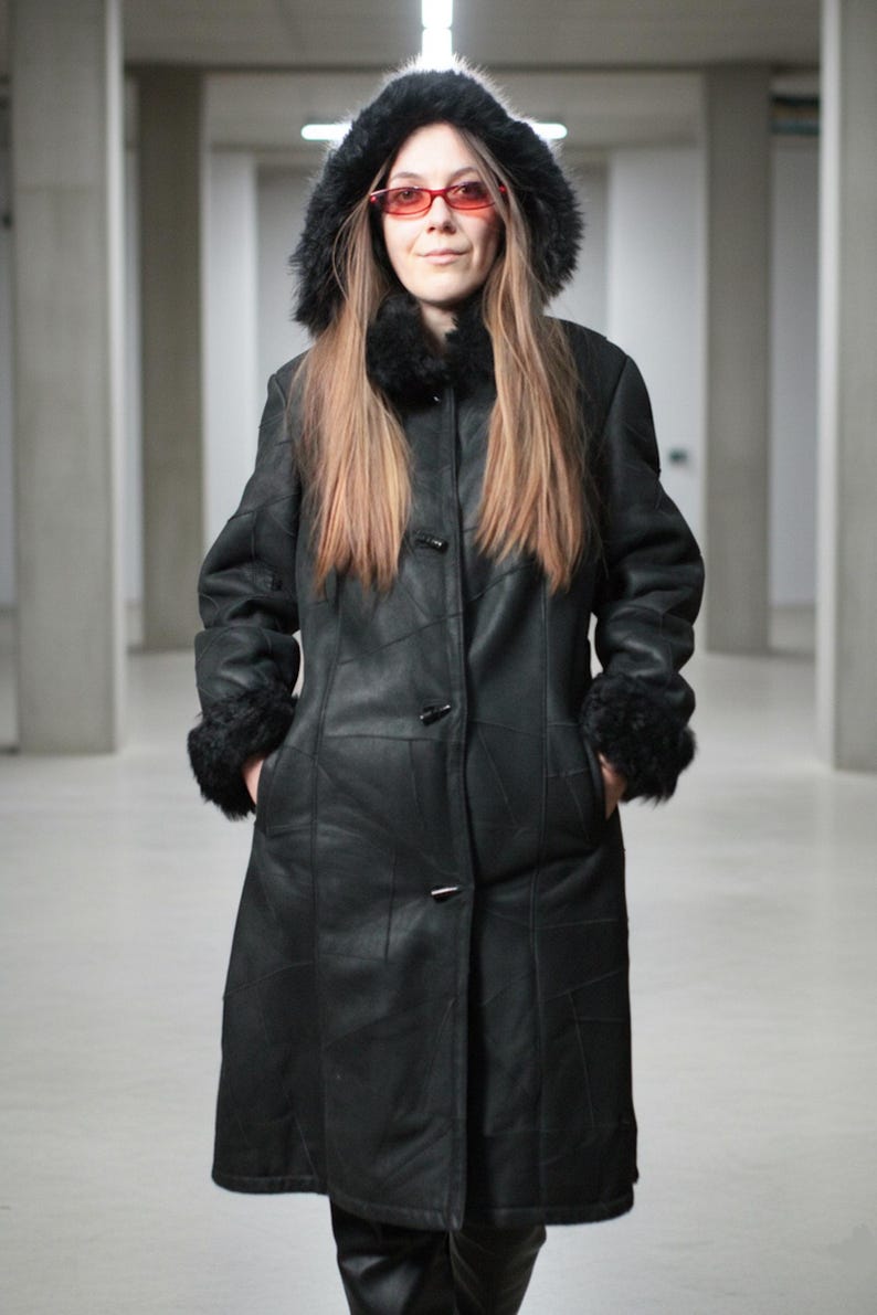 Hooded black shearling sheepskin coat with fur interior
