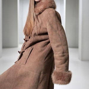 vintage brown sheepskin coat with shearling fur collar and hems