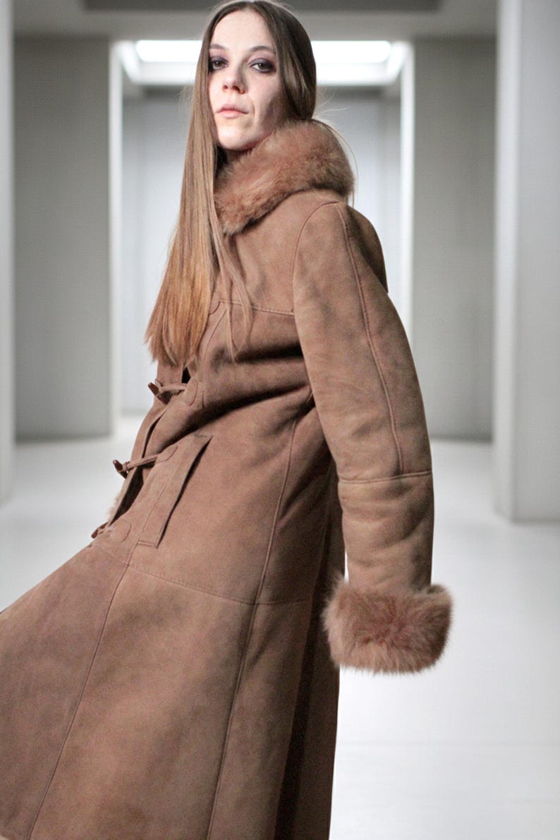vintage brown sheepskin coat with shearling fur collar and hems