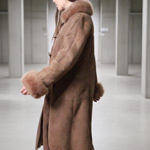 vintage brown sheepskin coat with shearling fur collar and hems