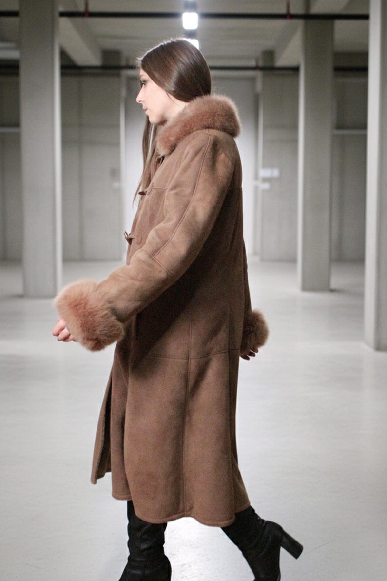 vintage brown sheepskin coat with shearling fur collar and hems