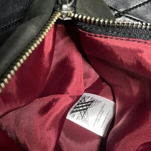 Large fold-over leather clutch bag with burgundy red interior