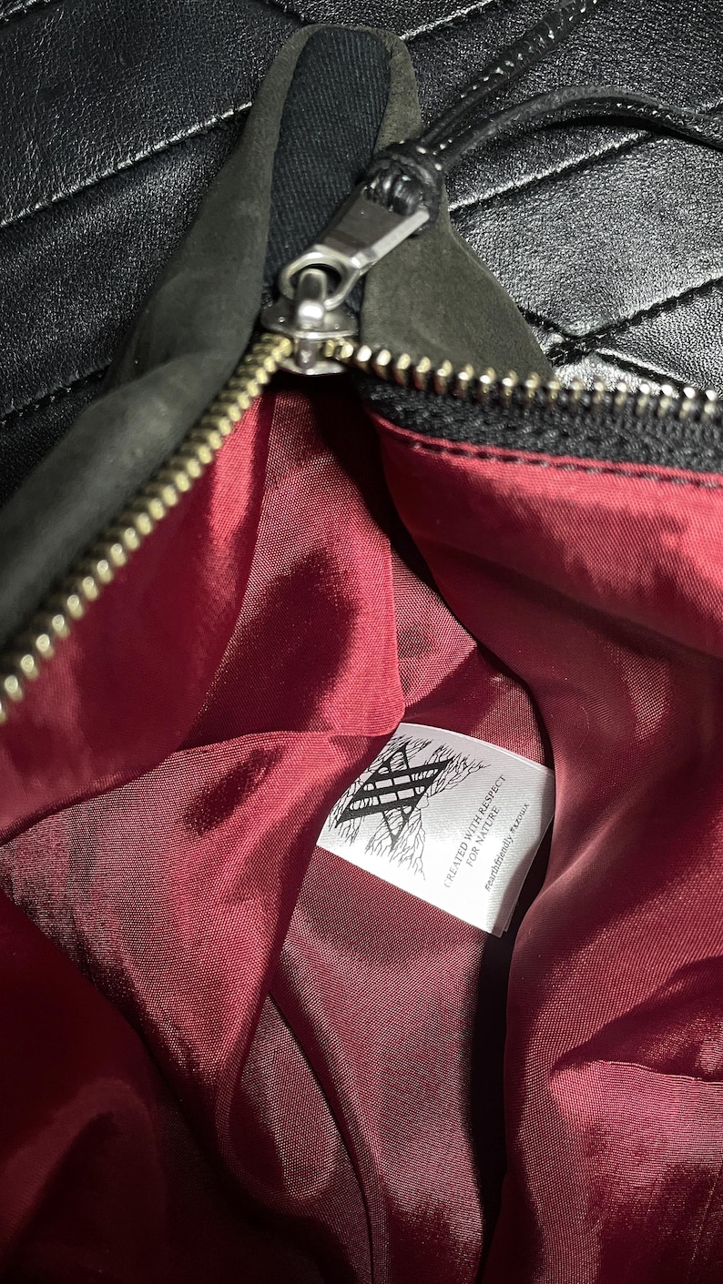 Large fold-over leather clutch bag with burgundy red interior