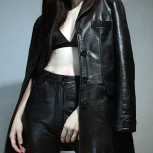 Vintage  leather blazer with high waisted leather pants and aviator sunglasses